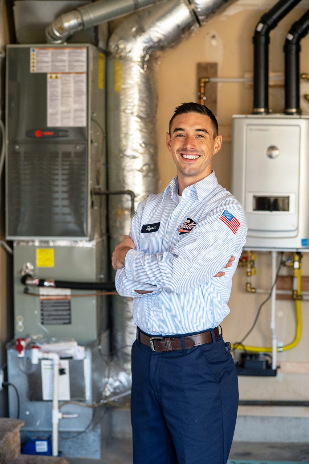 tech next to hot water heater